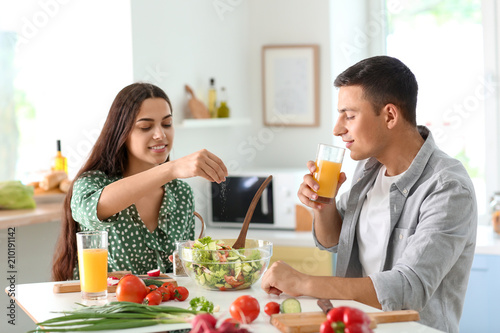 Friends cooking together in...