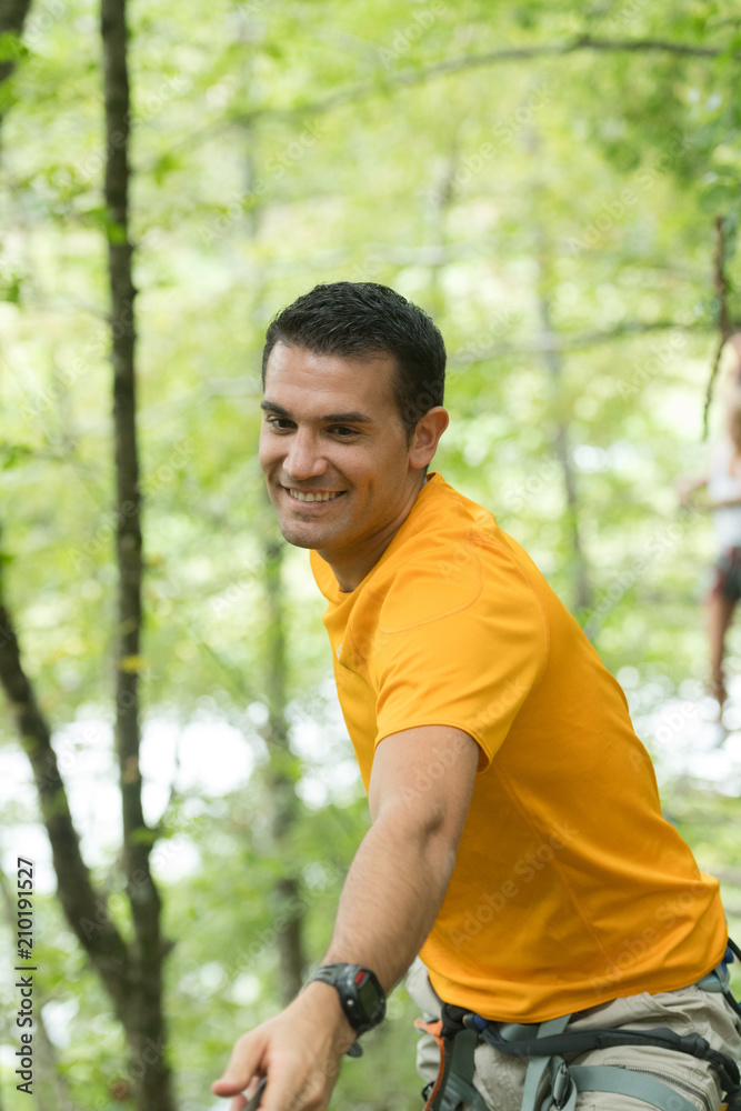 man in adventure park in forest man in adventure park in forest