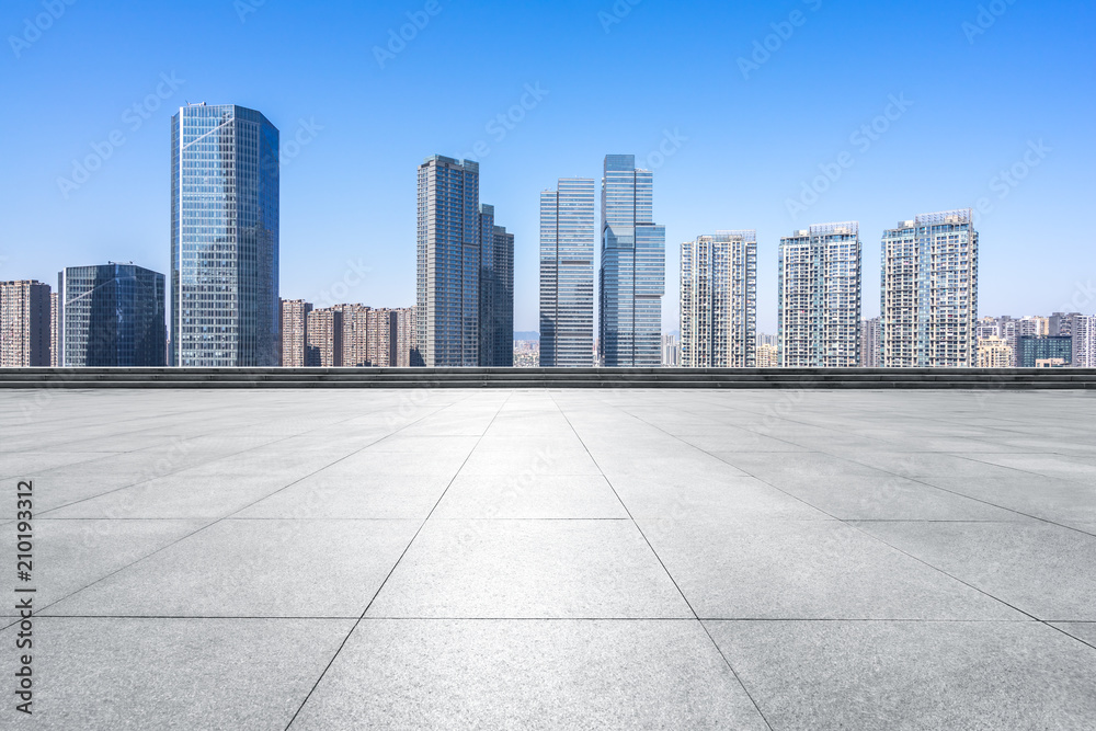 empty square with panoramic city skyline