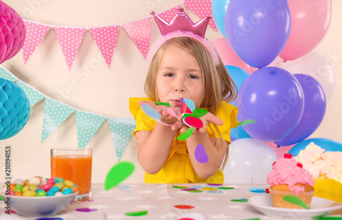 Cute little girl celebratin...