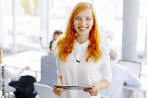 Pretty young red hair woman...
