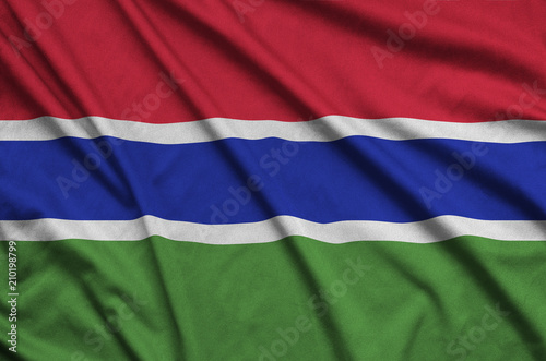 Gambia flag  is depicted on a sports cloth fabric with many folds. Sport team banner photo