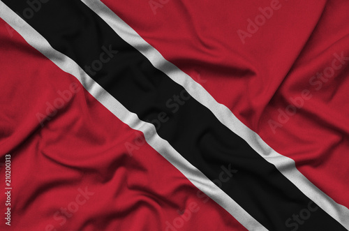 Trinidad and Tobago flag  is depicted on a sports cloth fabric with many folds. Sport team banner photo