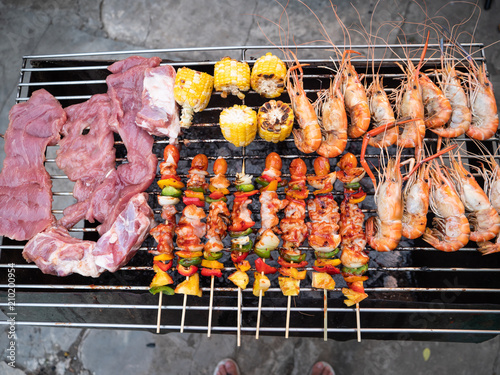 BBQ and shrimp on charcoal stove vintage style in thailand.
