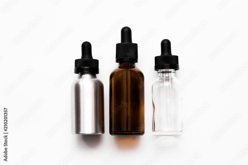 three bottles of medicine with a dropper, isolated on a white background