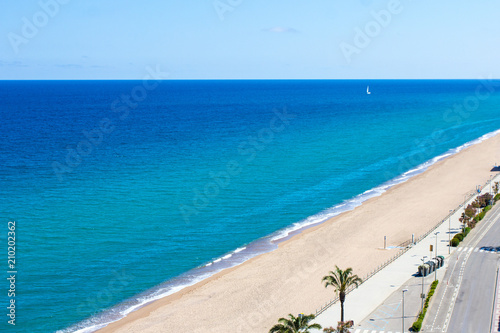 summer background - sea coast with yellow sandy beach in Spain