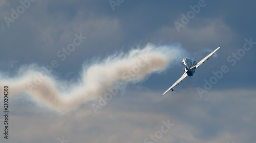Airplane and smoke at air show