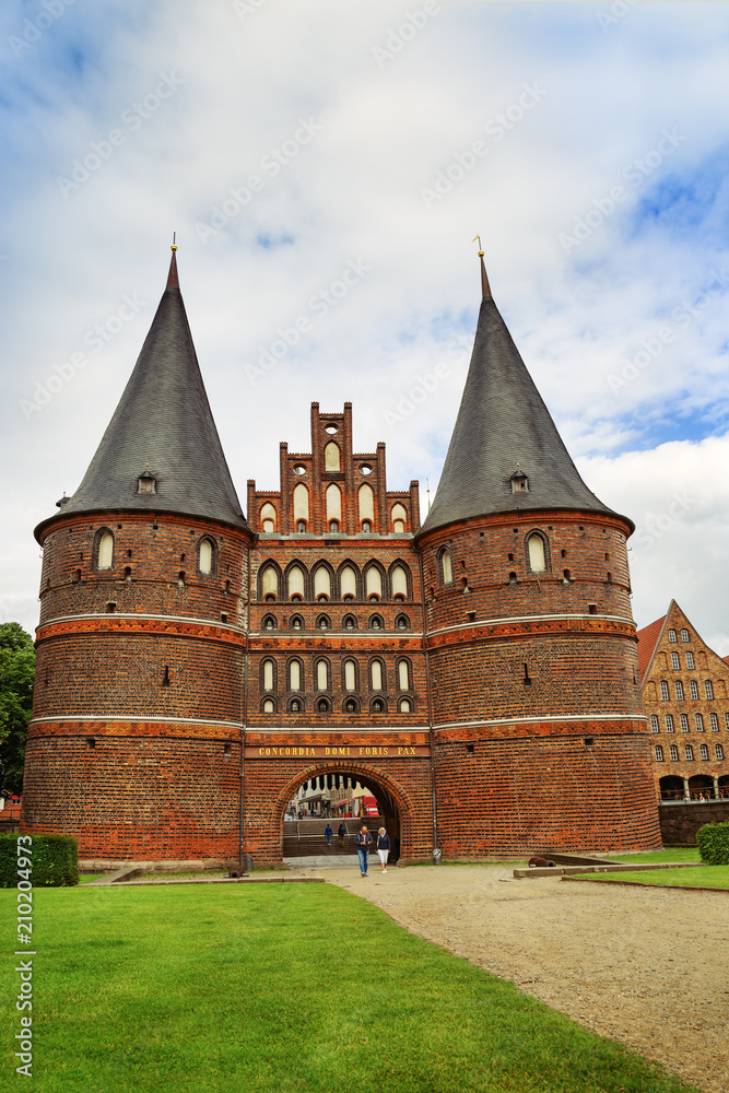 Urban landscape of city of lubeck. Attraction of old town. Walking tourists. Germany, June 2017.