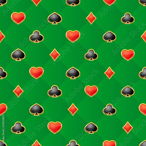 Seamless pattern with playing card suits on green background