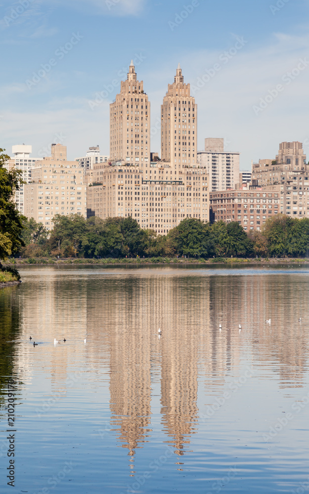 Jackie Onassis Reservoir.  The view across the Jackie Onassis Reservoir in Central Park, New York City in the United States of America on a still autumn morning.