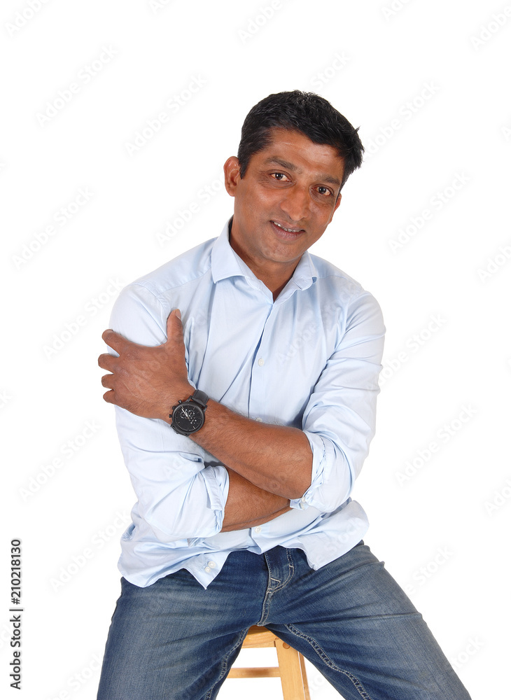 Nice looking Asian man sitting Nice looking Asian man sitting