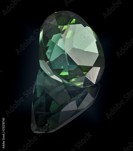 tourmaline gem stone isolated on black background