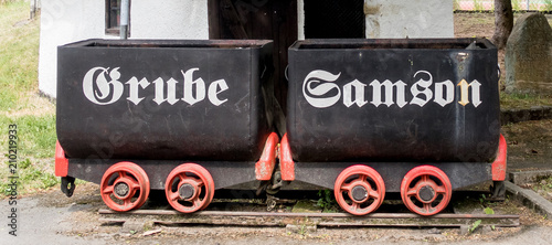 Old Mining trolleys in front of the World Heritage Mine “Grube Samson”, Sankt Andreasberg, Harz Mountains, Germany photo