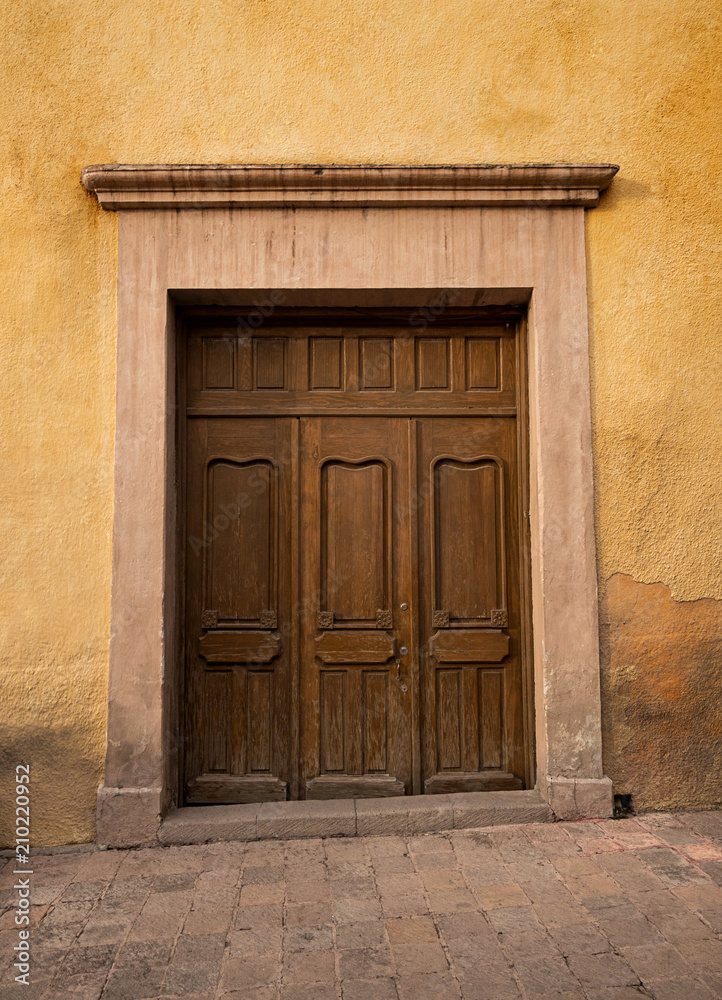 Mexican old colonial style wooden door in San Miguel de Allende Mexico
