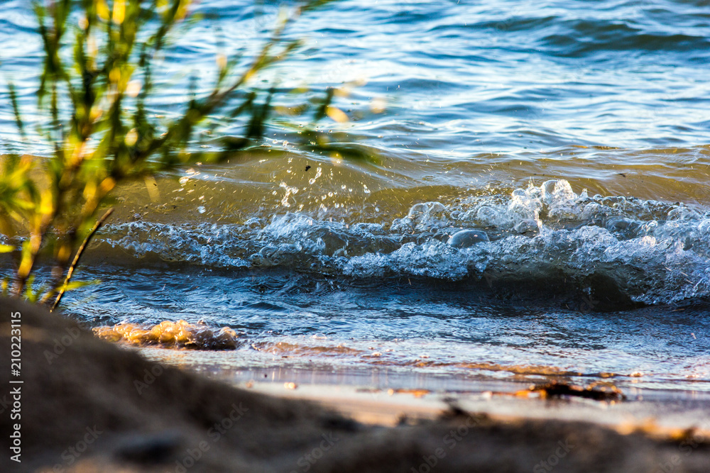 Fototapeta premium Calm Waves Break On A Sand Beach Along Lake Michigan