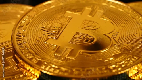 Golden Bitcoins Money. New Virtual Currency. Business concept. Extreme Close Up photo