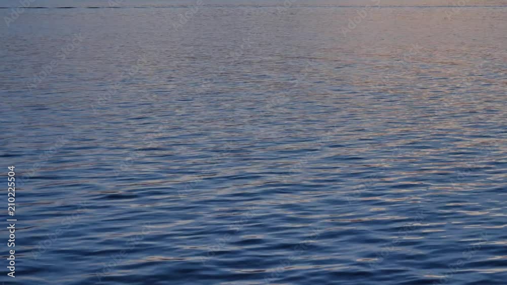 Water surface at sea, dusk, in UHD resolution