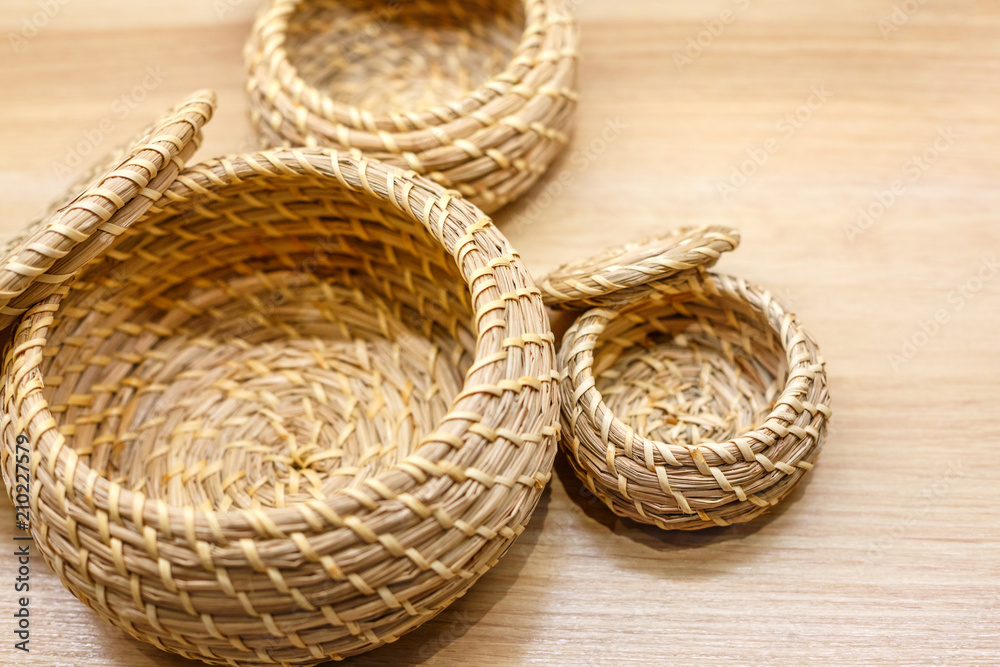 wicker baskets of bamboo are on the table wicker baskets of bamboo are on the table