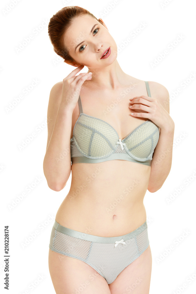 Fototapeta premium Attractive slim woman in grey matching underwear