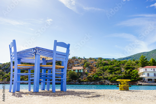 Fototapeta Naklejka Na Ścianę i Meble -  Open cafe outdoor restaurant in Greece on sea shore