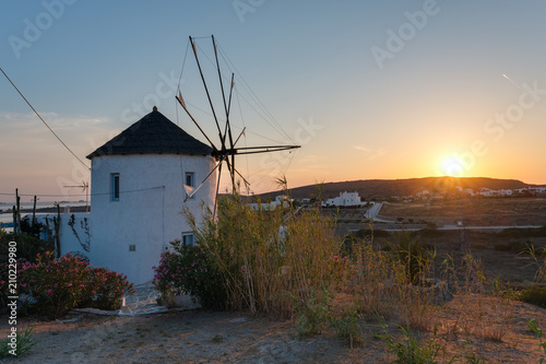 Traditional cycladic windmill at sunset on Paros island, Cyclades, Greece