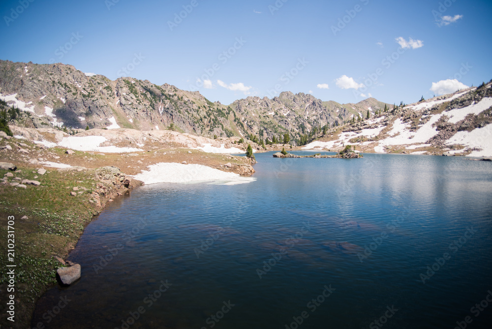 Landscape view of Booth Lake with mountains in the background near Vail, Colorado. Landscape view of Booth Lake with mountains in the background near Vail, Colorado.