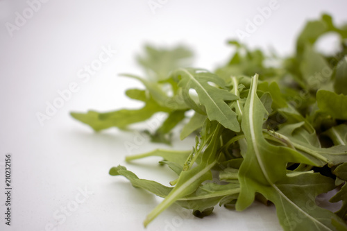 Eruca sativa isolated on white background.Fresh rucola leaves on background