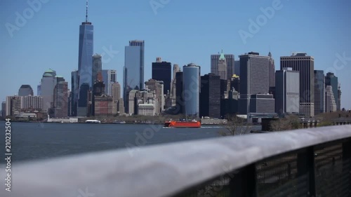 Lower Manhattan With Ferry Passing Governors Island NYC