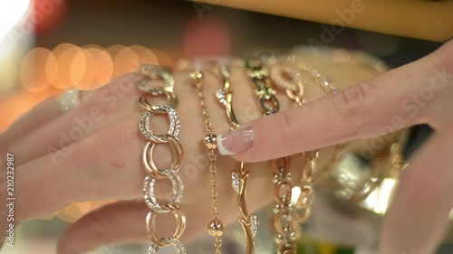 Jewels Market - the seller shows gold jewelry earrings, rings, bracelets, chain