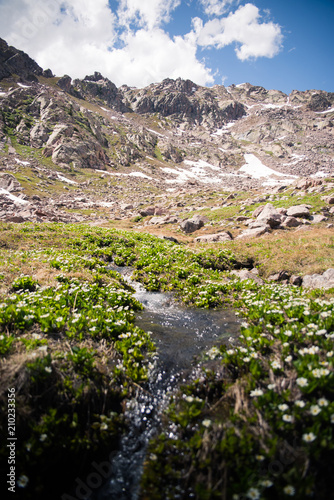 A stream with a large mountain in the background at Booth Lake near Vail, Colorado. 