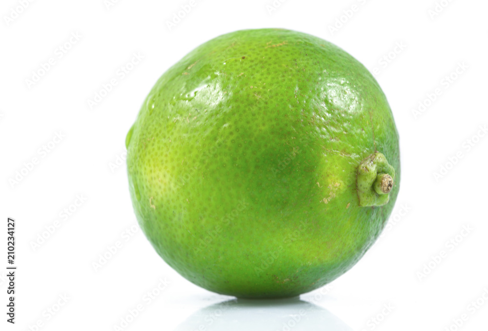 Juicy slice of lime, citrus fruit with green lemon half isolated on white background, Tropical fruit, Flat lay, top view. Juicy slice of lime, citrus fruit with green lemon half isolated on white background, Tropical fruit, Flat lay, top view.