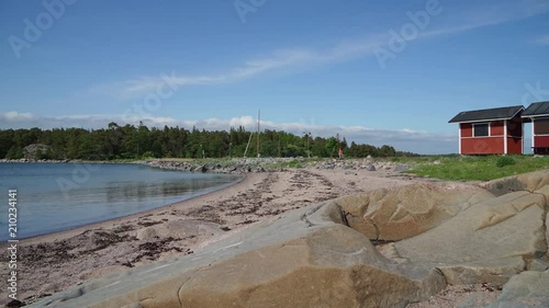 Timelapse of clouds passing over iconic beach shacks in Hanko, Finland 