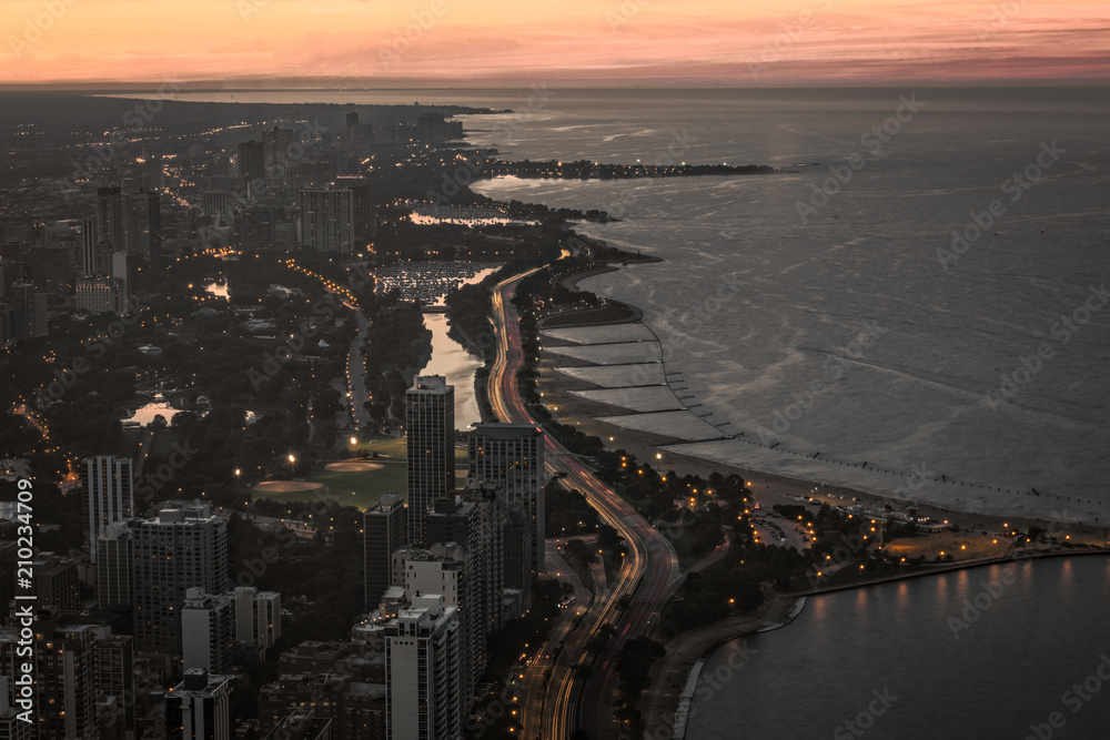 An Aerial View Looking Down Chicagos Lake Front At Sunset