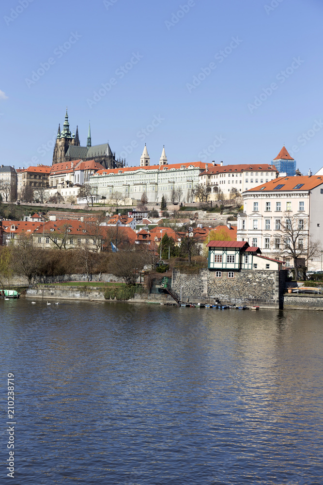 Fototapeta premium Spring Prague gothic Castle with the Lesser Town above River Vltava in the sunny Day, Czech Republic