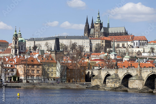 Spring Prague gothic Castle and Charles Bridge with the Lesser Town in the sunny Day, Czech Republic