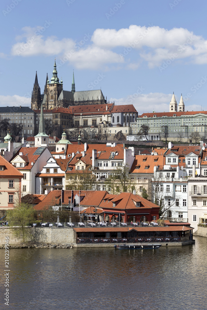 Obraz premium Spring Prague gothic Castle with the Lesser Town above River Vltava in the sunny Day, Czech Republic
