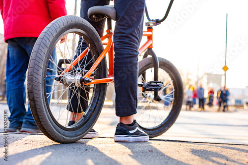 Urban biking - teenage boy riding bike in city