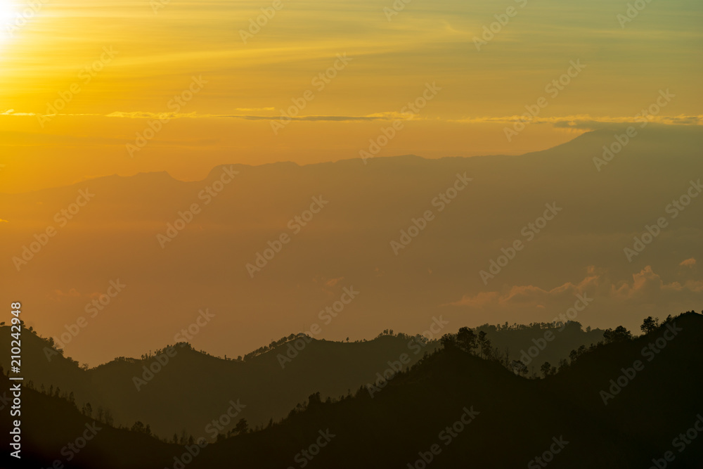 Majestic and misty sunrise over mountain range at Bromo Tengger Semeru National Park, Indonesia.