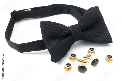 A black pre-tied bow tie with matching cuff links
