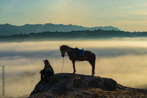 Unidentified local people or Bromo Horseman at the mountainside of Mount Bromo  Semeru  Tengger National Park  East Java of Indonesia.