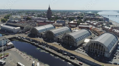 Central market in Riga city historical Europe town living houses and building with roads and cars traffic Drone flight photo