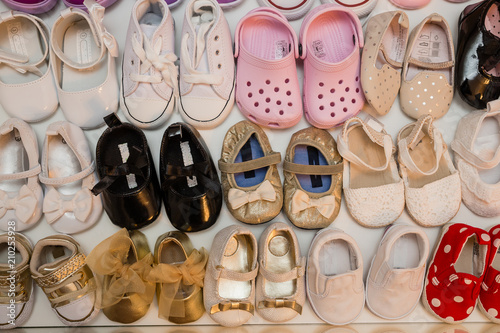 colorful brand new baby girl shoes inside closet