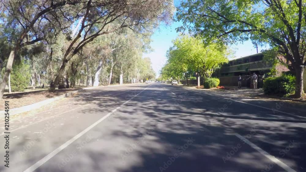 Vehicle POV driving along South Terrace, Adelaide South Australia, with views of south gardens and natural parklands. Vehicle POV driving along South Terrace, Adelaide South Australia, with views of south gardens and natural parklands.