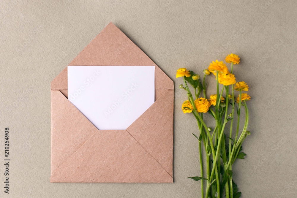 Bouquet of yellow flowers and blank on pastel background, beautiful breakfast, vintage romantic card, top view, flat lay, rustic style Bouquet of yellow flowers and blank on pastel background, beautiful breakfast, vintage romantic card, top view, flat lay, rustic style