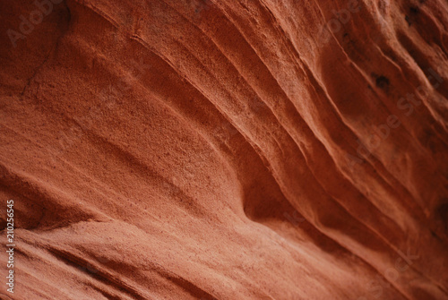 Bright orange texture of a slot canyon