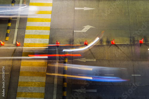 Photography The road marking the crossing is provided for people crossing the street with moving car lights