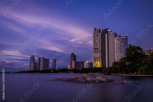 Exposure colorful at twilight time of building at pattaya beach with twilight background