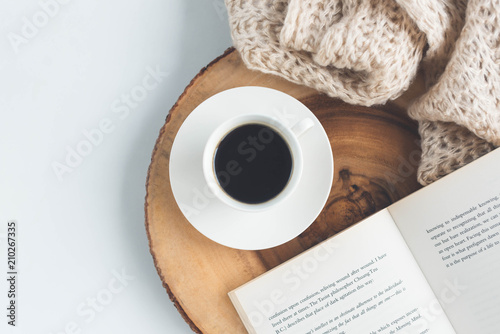 Cup of coffee and book on the table