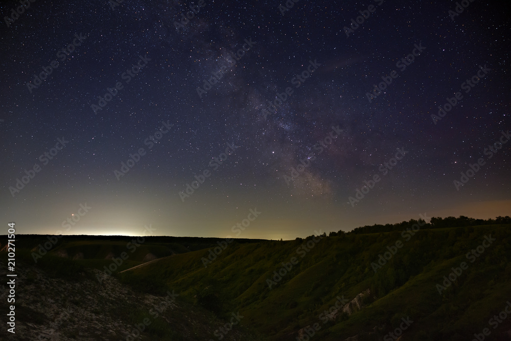 Stars of the Milky Way in the night sky. A view of the starry space background sunset illuminated the horizon. Stars of the Milky Way in the night sky. A view of the starry space background sunset illuminated the horizon.