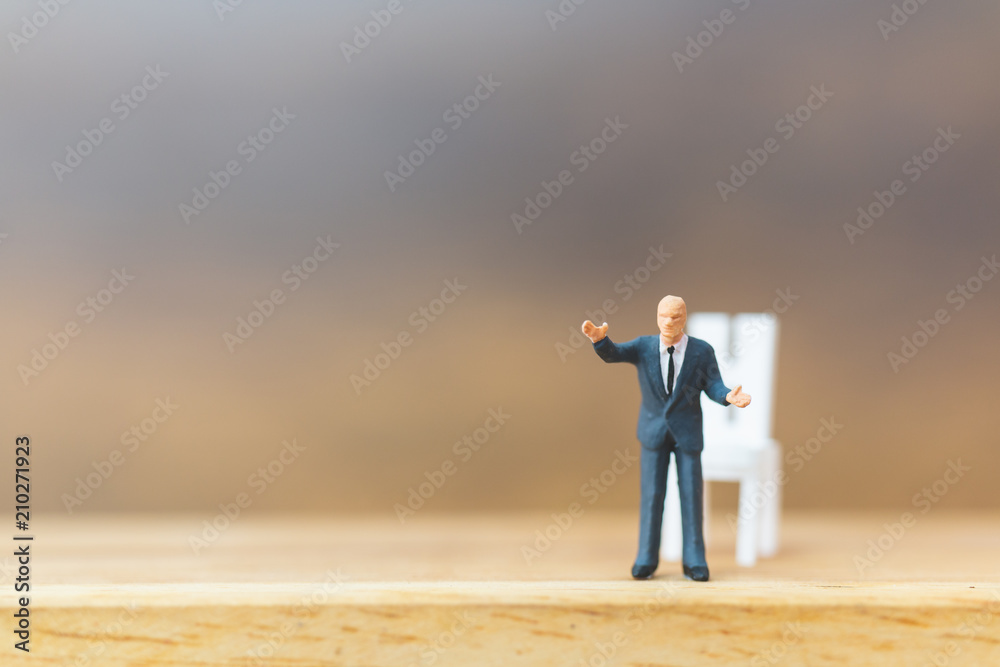 Miniature people Thinking about next great idea on wooden background Miniature people Thinking about next great idea on wooden background